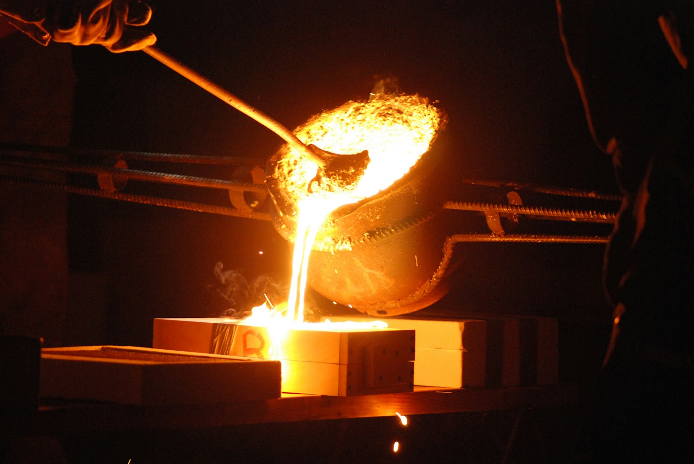 Molten aluminium poured from a ladle